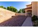 Spacious gravel backyard with block wall fencing and a basketball hoop for outdoor recreation at 2004 N 125Th Ave, Avondale, AZ 85392