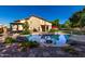 Spacious backyard with private pool, patio and desert landscaping, perfect for outdoor entertaining at 2004 N 125Th Ave, Avondale, AZ 85392