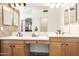 Bright bathroom with dual sinks, light wood cabinets, and tiled floors at 2004 N 125Th Ave, Avondale, AZ 85392
