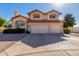 Charming two-story home featuring a two-car garage, red tile roof and a desert landscaped front yard at 2004 N 125Th Ave, Avondale, AZ 85392