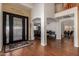 Inviting foyer with hardwood floors, decorative front door, and an open floor plan for seamless flow at 2004 N 125Th Ave, Avondale, AZ 85392