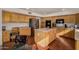 Spacious kitchen features custom cabinetry, an island, and stainless steel appliances, perfect for cooking and gatherings at 2004 N 125Th Ave, Avondale, AZ 85392