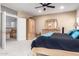 Spacious main bedroom boasts carpet floors and a dresser with mirror at 2004 N 125Th Ave, Avondale, AZ 85392