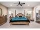Inviting main bedroom featuring neutral tones, carpet flooring, and a decorative ceiling fan at 2004 N 125Th Ave, Avondale, AZ 85392