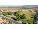 Park with playground, sand volleyball, walking path, green lawn, and shelter at 2004 N 125Th Ave, Avondale, AZ 85392