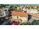 A two-story home featuring a clay tile roof, elevated deck, and outdoor living space, perfect for entertaining or enjoying quiet moments at 2004 N 125Th Ave, Avondale, AZ 85392