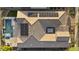 Aerial view of home featuring a backyard pool, patio area, and solar panels on the roof at 20595 W Pasadena Ave, Buckeye, AZ 85396