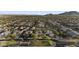 A high aerial view of a neighborhood with lush greenery and meticulously planned community landscaping at 20595 W Pasadena Ave, Buckeye, AZ 85396