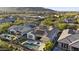Wide aerial view of the home and neighborhood, including a pool, backyard, patio, and solar panels at 20595 W Pasadena Ave, Buckeye, AZ 85396