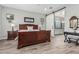 Spacious primary bedroom with ensuite bathroom access via sliding barn door at 20595 W Pasadena Ave, Buckeye, AZ 85396
