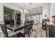 Open-concept dining area flows seamlessly to the modern kitchen and living spaces at 20595 W Pasadena Ave, Buckeye, AZ 85396