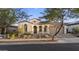 Charming single-story home boasting an arched entryway and a well-manicured front yard at 20595 W Pasadena Ave, Buckeye, AZ 85396