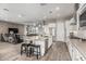 Bright kitchen with stainless appliances, granite countertops, opens to the spacious living area at 20595 W Pasadena Ave, Buckeye, AZ 85396