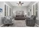 Comfortable living room with soft colors and natural light from shuttered windows at 20595 W Pasadena Ave, Buckeye, AZ 85396