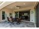 Outdoor living area with ceiling fan, dining, and easy access to the living room at 20595 W Pasadena Ave, Buckeye, AZ 85396