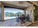 Inviting covered patio featuring a ceiling fan and views of the pool at 20595 W Pasadena Ave, Buckeye, AZ 85396