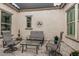 Covered patio boasts ample seating and stylish decor for outdoor relaxation at 20595 W Pasadena Ave, Buckeye, AZ 85396