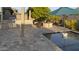 Charming outdoor space with a pool, built-in grill, and fire pit surrounded by comfortable seating at 20595 W Pasadena Ave, Buckeye, AZ 85396
