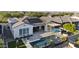 This beautiful home features a private pool, outdoor seating, firepit, covered patio, and solar panels on the roof at 20595 W Pasadena Ave, Buckeye, AZ 85396