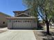 Charming two-story home featuring a tile roof and a spacious two car garage at 22632 W Solano Dr, Buckeye, AZ 85326