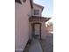 Inviting covered front entryway features a secure screen door and a charming archway at 22632 W Solano Dr, Buckeye, AZ 85326