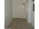 Clean, bright tiled front entrance with neutral walls at 22632 W Solano Dr, Buckeye, AZ 85326