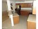 Open kitchen layout with stainless appliances, wood cabinets, and tiled flooring at 22632 W Solano Dr, Buckeye, AZ 85326