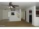 Bright living room offers access to the kitchen and the carpeted stairwell to the bedrooms at 22632 W Solano Dr, Buckeye, AZ 85326