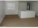 Loft area with plush carpet flooring, a window and white painted walls at 22632 W Solano Dr, Buckeye, AZ 85326