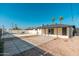 Wide backyard view featuring a pool, shaded patio and gravel area and palm trees at 2342 N 40Th Ave, Phoenix, AZ 85009