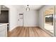 Bright dining area with wood floors, contemporary light fixture and sliding glass doors to the outside at 2342 N 40Th Ave, Phoenix, AZ 85009