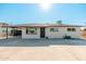 Front exterior showcasing a well-maintained yard, covered parking and freshly painted façade of this lovely Phoenix home at 2342 N 40Th Ave, Phoenix, AZ 85009