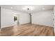 Spacious living room bathed in natural light, featuring wood-look flooring and neutral wall colors at 2342 N 40Th Ave, Phoenix, AZ 85009
