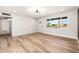 Bright, open-concept living room with wood-look flooring and a freshly painted interior at 2342 N 40Th Ave, Phoenix, AZ 85009