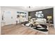 Cozy living room with stylish decor, wood-look flooring, and natural light from the large window at 2342 N 40Th Ave, Phoenix, AZ 85009