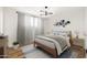 Stylishly staged main bedroom with wood floors, accent wall and a decorative area rug at 2342 N 40Th Ave, Phoenix, AZ 85009