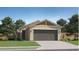 Charming single-story home with a two-car garage, desert landscaping, and a well-maintained lawn at 25052 N 174Th Ln, Surprise, AZ 85387