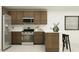A modern kitchen featuring stainless steel appliances, wood cabinets, and white countertops at 25052 N 174Th Ln, Surprise, AZ 85387
