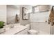 Bathroom with a walk-in shower, bright vanity and decorative finishes at 25424 N 176Th Ave, Surprise, AZ 85387
