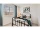 Cozy bedroom with natural light, metal bedframe, soft bedding, and stylish decor at 25424 N 176Th Ave, Surprise, AZ 85387