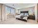 Bright bedroom featuring a comfortable bed, large windows, and neutral tones at 25424 N 176Th Ave, Surprise, AZ 85387