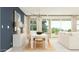 Bright dining area featuring modern lighting, stylish furniture, and access to outdoor living space at 25424 N 176Th Ave, Surprise, AZ 85387
