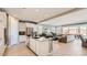 Open floorplan featuring an island kitchen, stainless appliances, and a seamless flow to the living room at 25424 N 176Th Ave, Surprise, AZ 85387