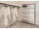 Bright walk-in closet featuring built-in shelving and hanging rods at 25424 N 176Th Ave, Surprise, AZ 85387