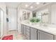 Bathroom featuring double sinks with modern cabinetry and a large mirror at 25546 N 164Th Dr, Surprise, AZ 85387