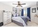 Bedroom featuring neutral color palette, updated ceiling fan, and view of the mountains at 25546 N 164Th Dr, Surprise, AZ 85387