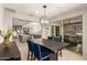 Dining area with modern decor, with the kitchen and living room in the background at 25546 N 164Th Dr, Surprise, AZ 85387