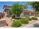 Charming two-story home features a well-manicured lawn, desert landscaping, and a spacious two car garage at 25546 N 164Th Dr, Surprise, AZ 85387