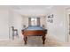 Spacious game room with a full-sized pool table, perfect for entertaining at 25546 N 164Th Dr, Surprise, AZ 85387