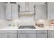 Close up of the kitchen featuring a quartz counter top, stainless steal appliances, and tile backsplash at 25546 N 164Th Dr, Surprise, AZ 85387